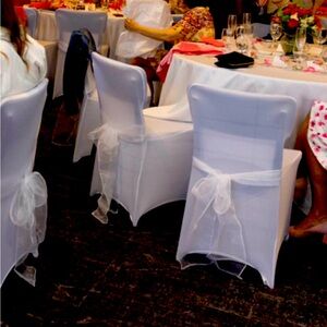 Chair covers with sashes.